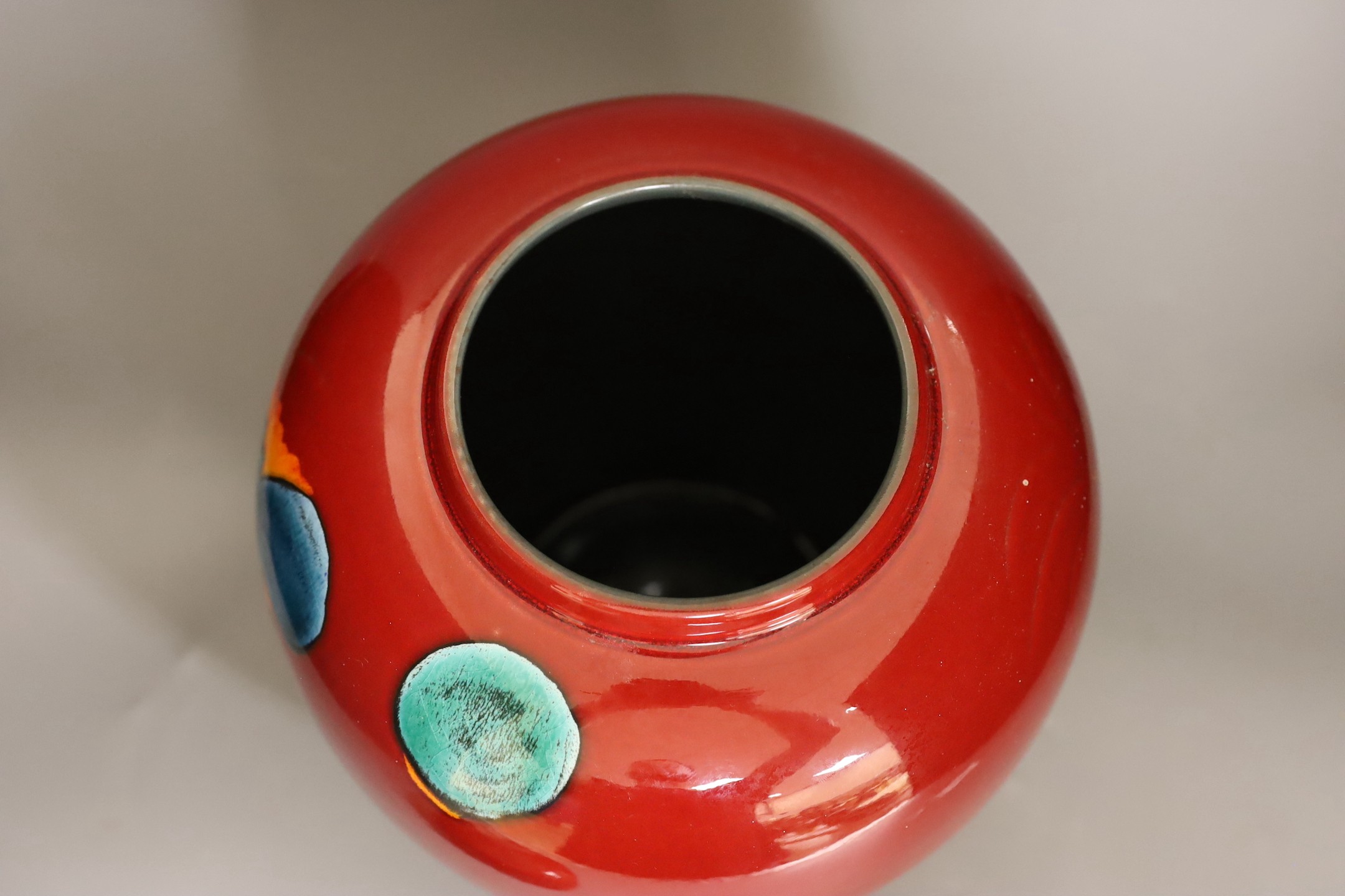 A large Poole Volcano design jar and cover, 32cm high